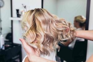 Woman with dark blonde balayaged hair